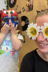 child with parent wearing fun glasses